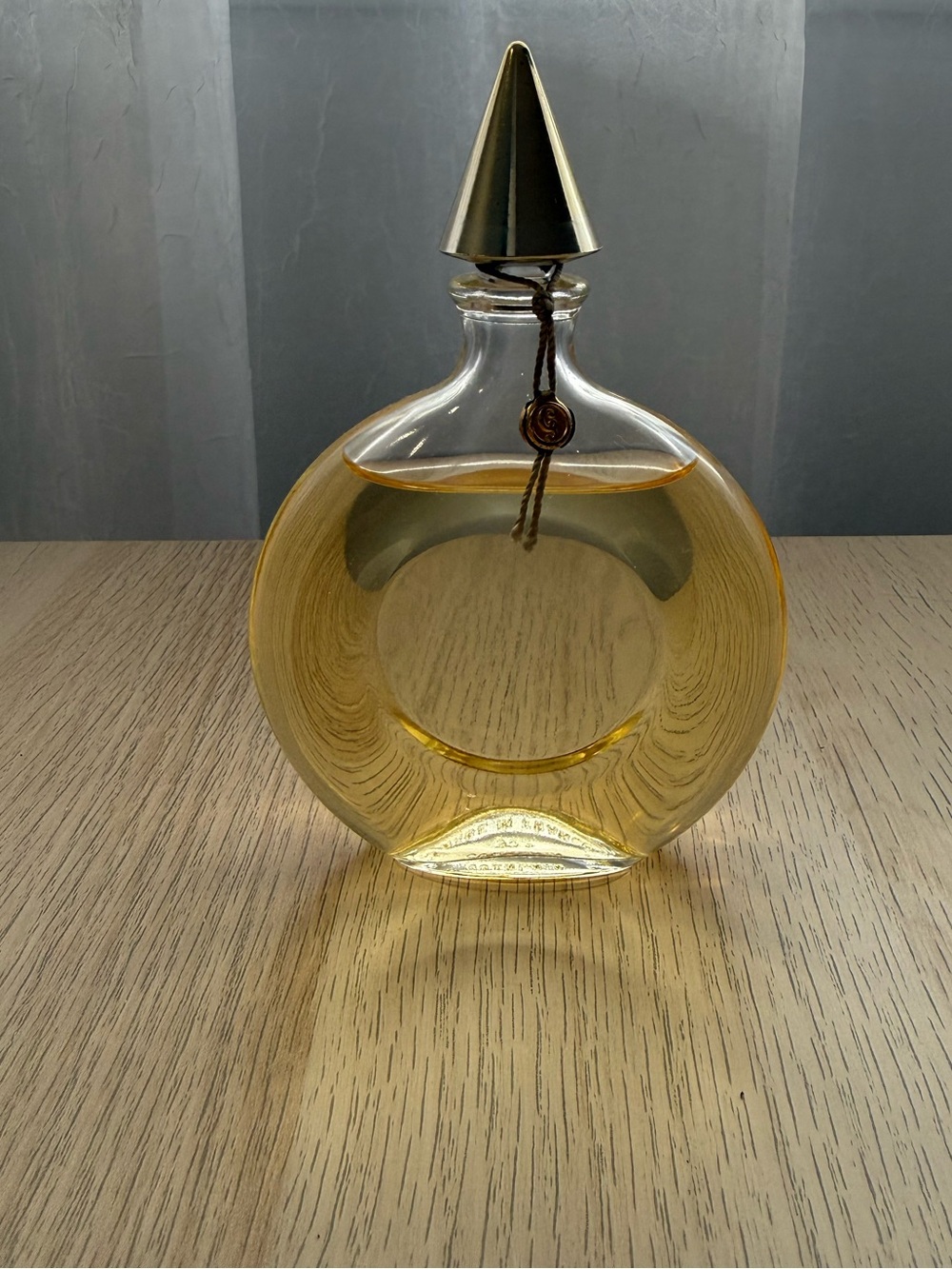 GUERLAIN Round Glass Décor Bottle in Golden Yellow with Gold Cap